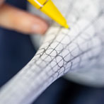 Rhian Malin decorating a mandala bottle in her workshop 2019